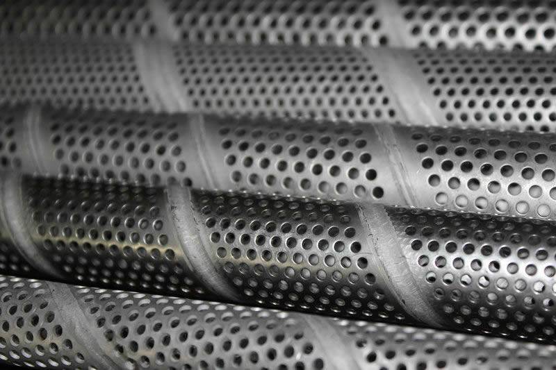 Aluminum spiral lock seam perforated tubes with round holes.