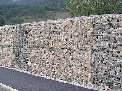 Galvanized gabion noise barrier is installed in the highway.