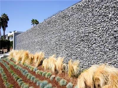 Gabion noise barrier is installed in the private luxury building as a wall.