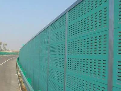 Green absorptive PVC sound barrier with micro holes.