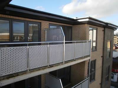 There are a perforated metal infill panels installed on the balcony.