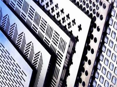 Several perforated metal infill panels with margins and different holes stack together.
