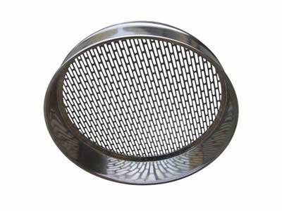 The picture shows a perforated test sieve with oval and slotted holes.